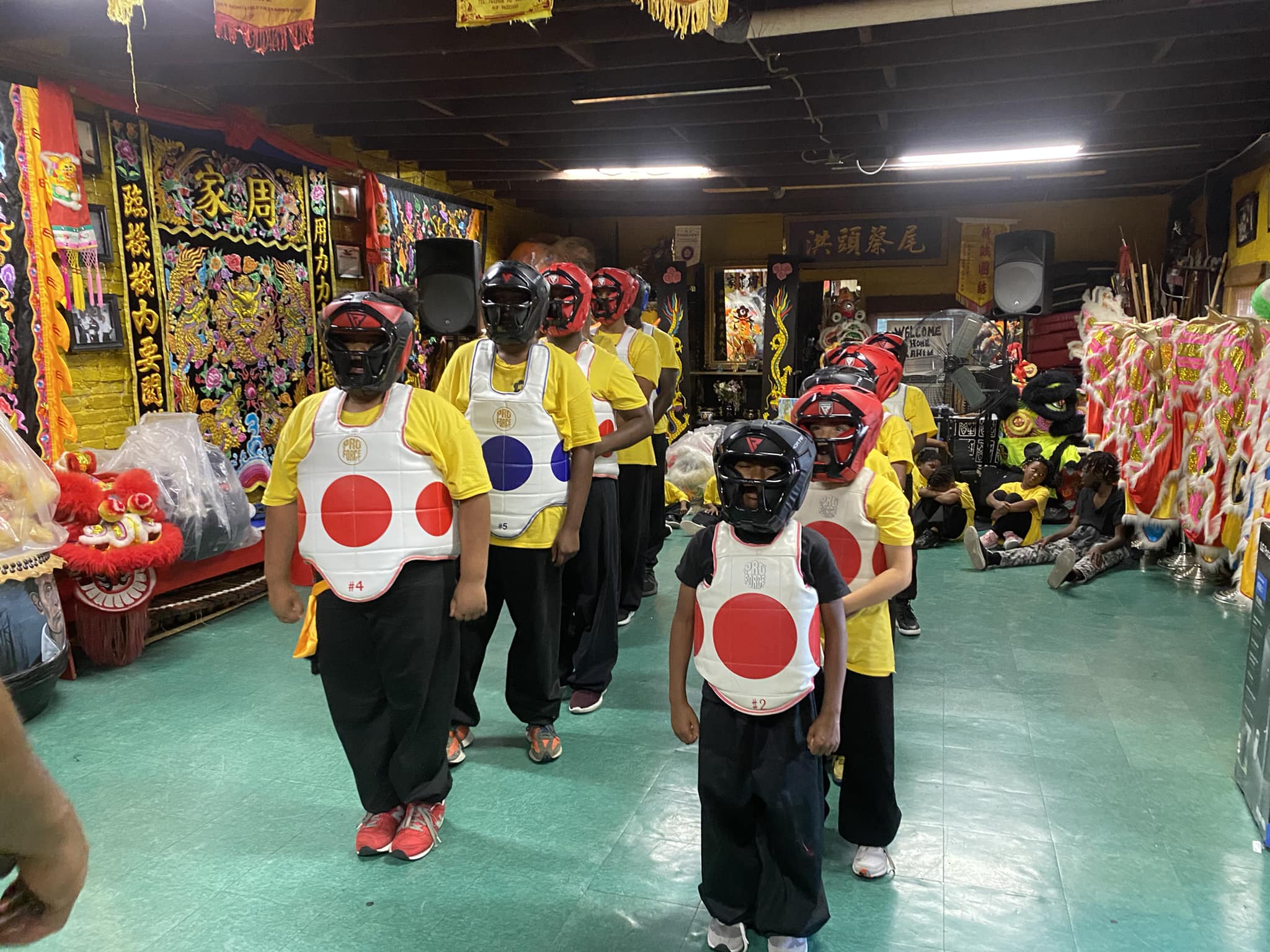 Summer campers in martial arts gear ready for training
